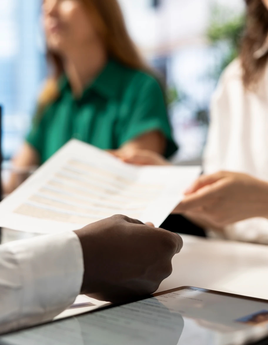 DORA compliance consultant reviewing documentation with client, emphasizing thorough assessment and implementation support