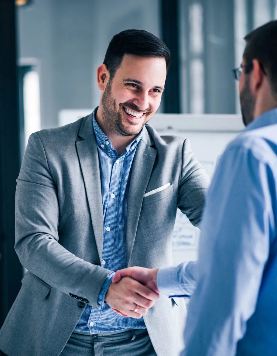 ISO consultant and client making a deal, shaking hands.