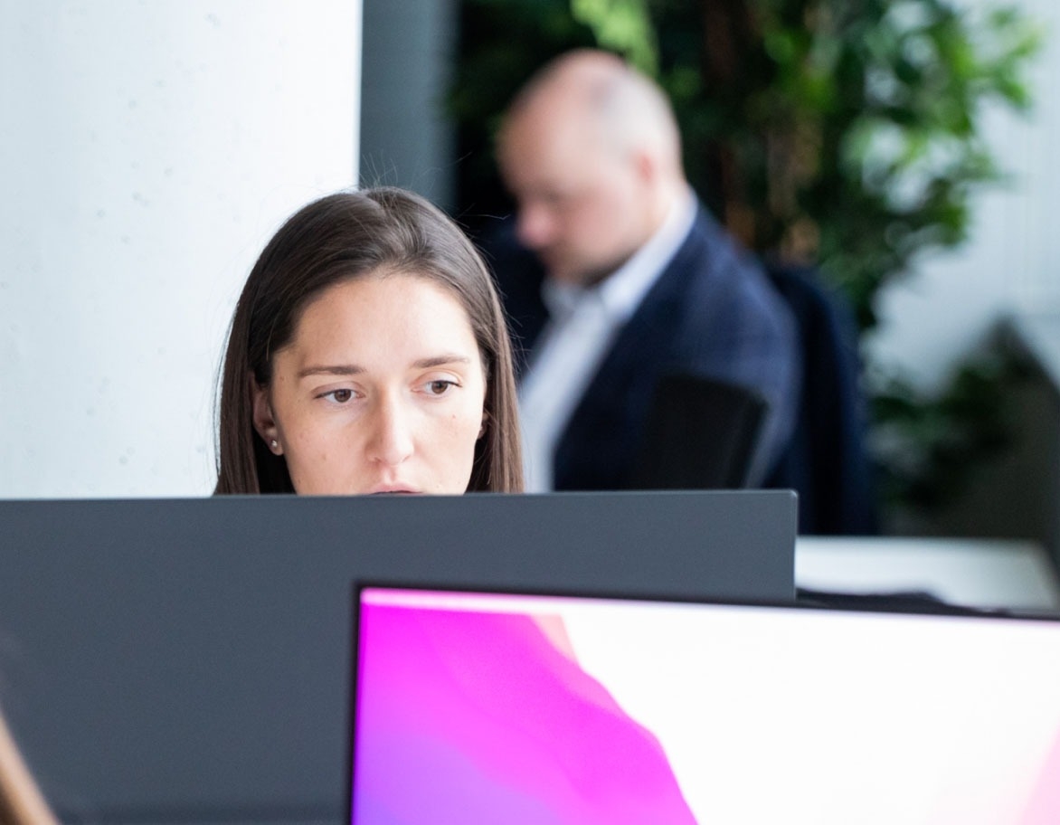 A person looking at the monitor.