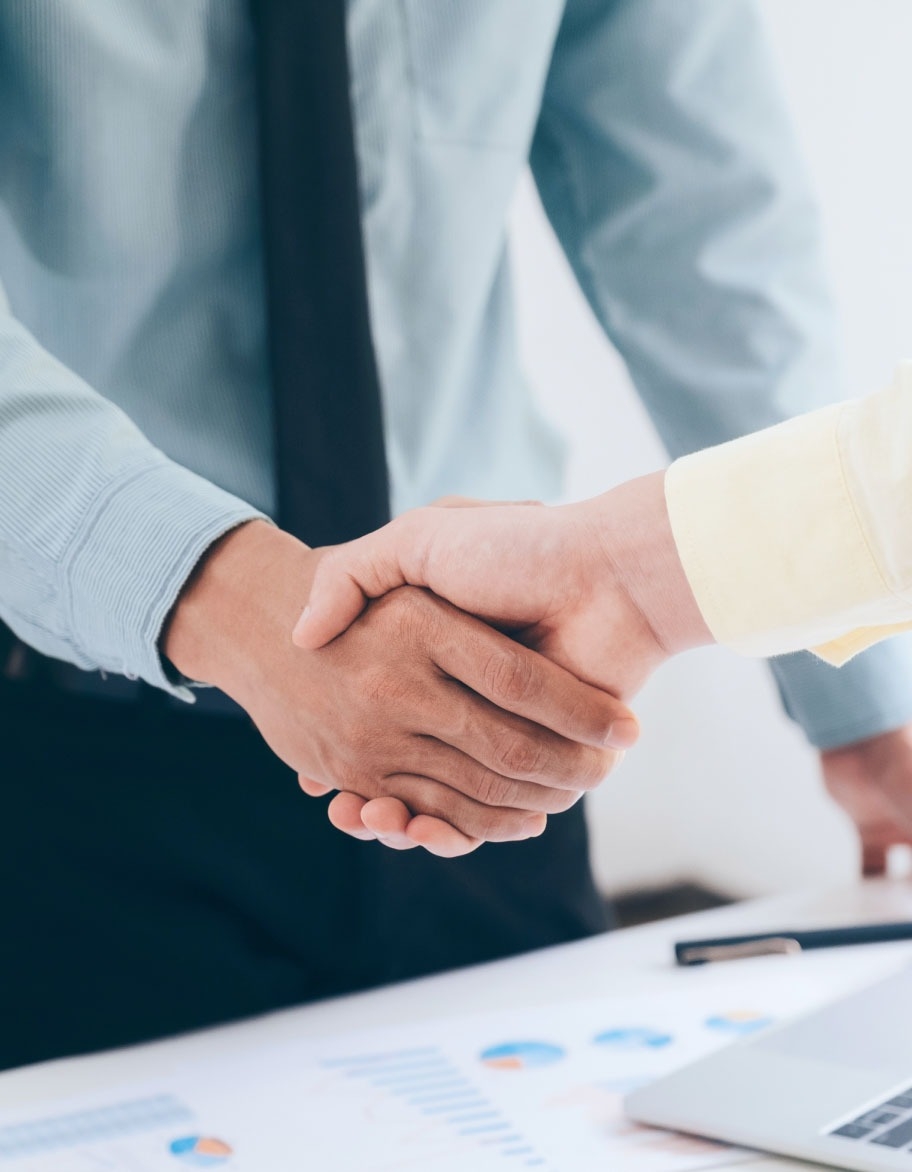 Two persons shaking hands.